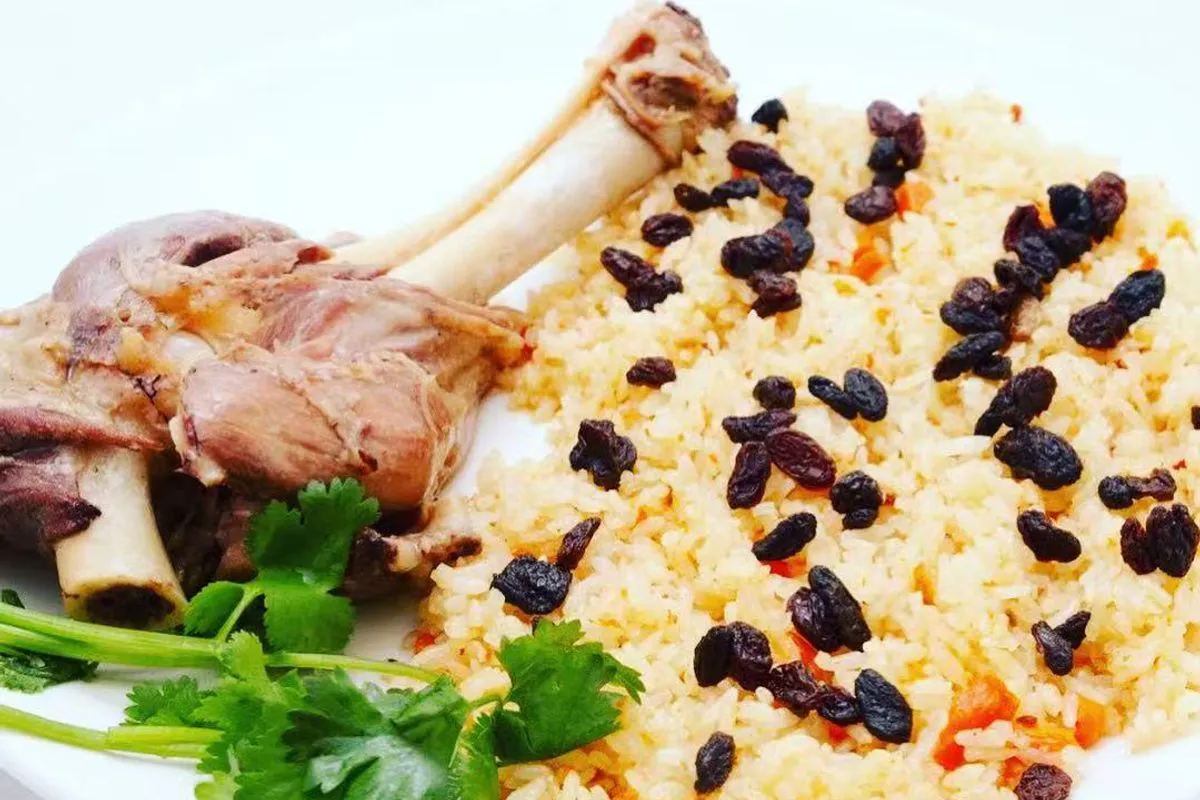 Uyghur plov rice with lamb and raisins at Bogda Uyghur Restaurant, a Central Asian Halal Restaurant in Plano
