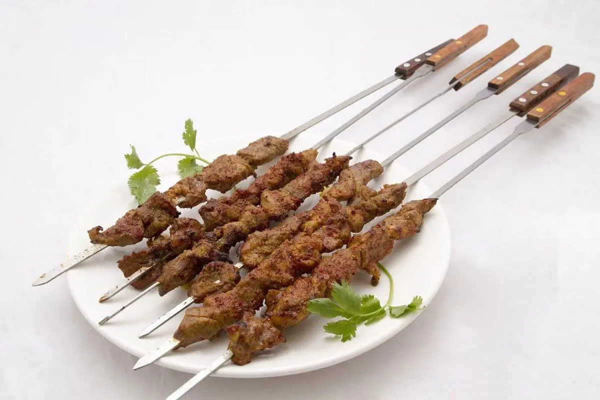 Grilled lamb kebab skewers with spices at Bogda Uyghur Restaurant, a Central Asian Halal Restaurant in Plano